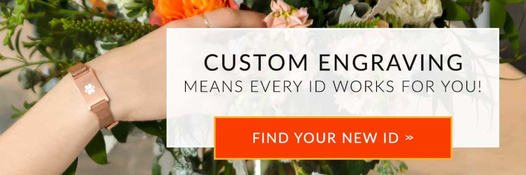 Woman touching flowers and wearing rose gold medical ID bracelet with mesh band