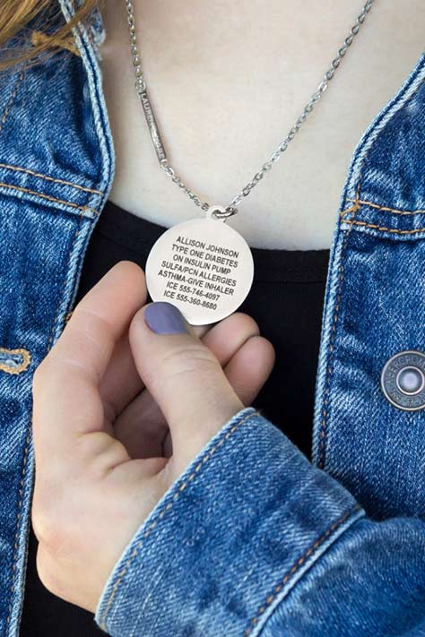 Custom engraved medical alert necklace shown with heart patient engraving. 